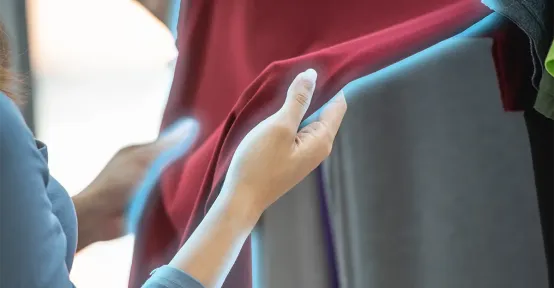 HeiQ Cool™ Image of a Person Touching a Cool Treated Fabric