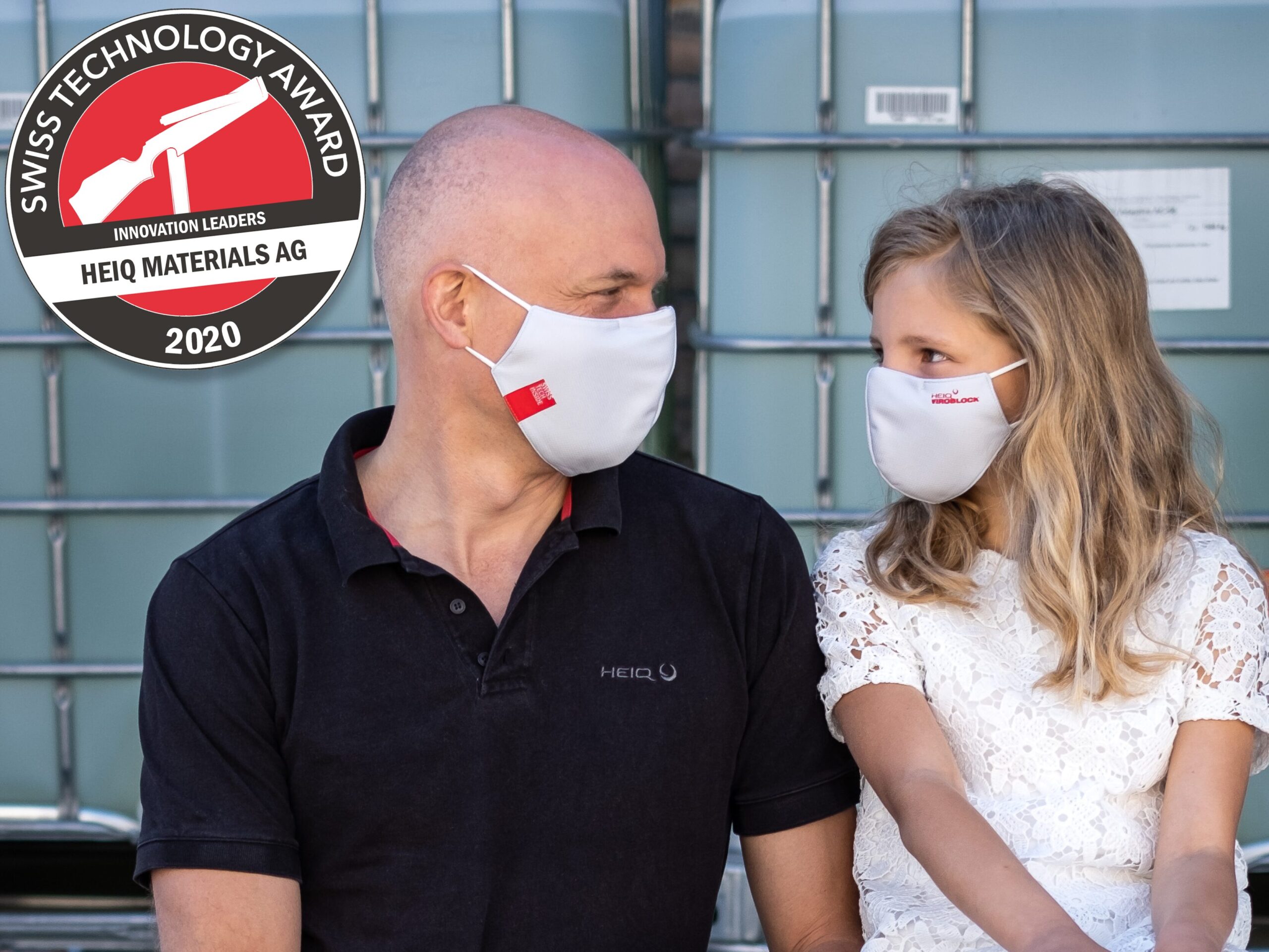 Two people wearing HeiQ Viroblock masks with an antimicrobial fabric treatment from Swiss Technology Award winner HeiQ Materials AG